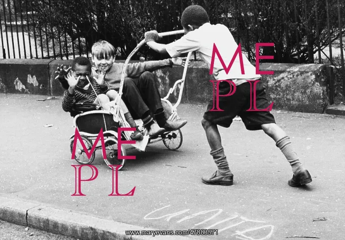 : Boys playing with an old pram frame : Boys playing with an old pram frame