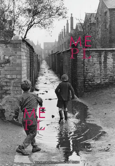  : Boys playing in a puddle in an alleyway