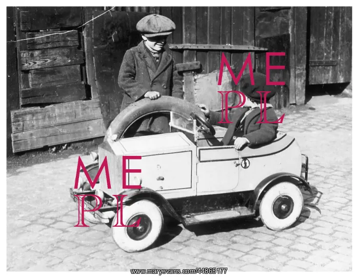 : Boys playing with toy car, 1930s : Boys playing with toy car, 1930s