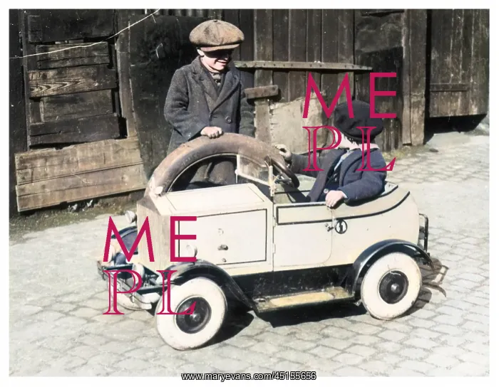: Boys playing with toy car, 1930s : Boys playing with toy car, 1930s