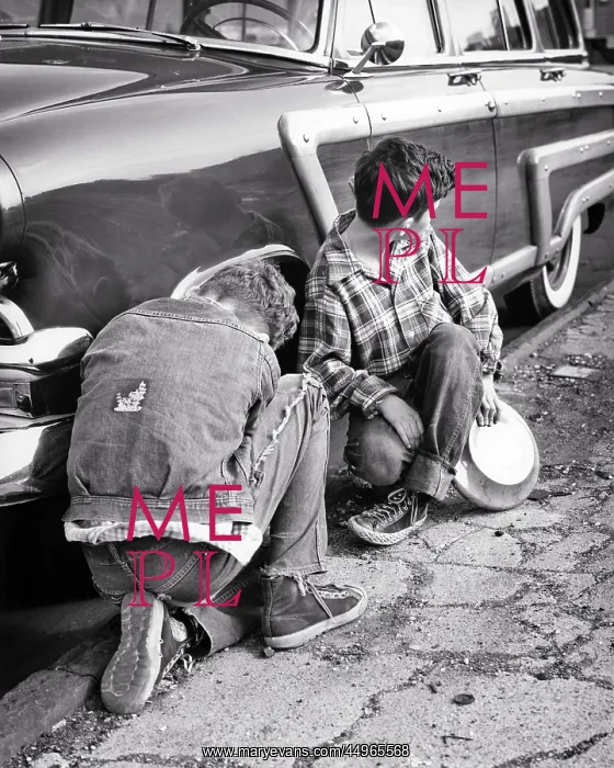 : Two Boys in Ragged Clothes Stealing Hubcaps from : Two Boys in Ragged Clothes Stealing Hubcaps from