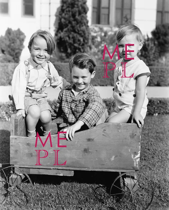 : Three boys sitting in a push cart and smiling : Three boys sitting in a push cart and smiling