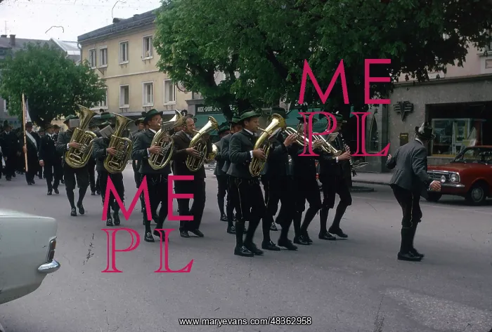 : Brass band marching along a street : Brass band marching along a street