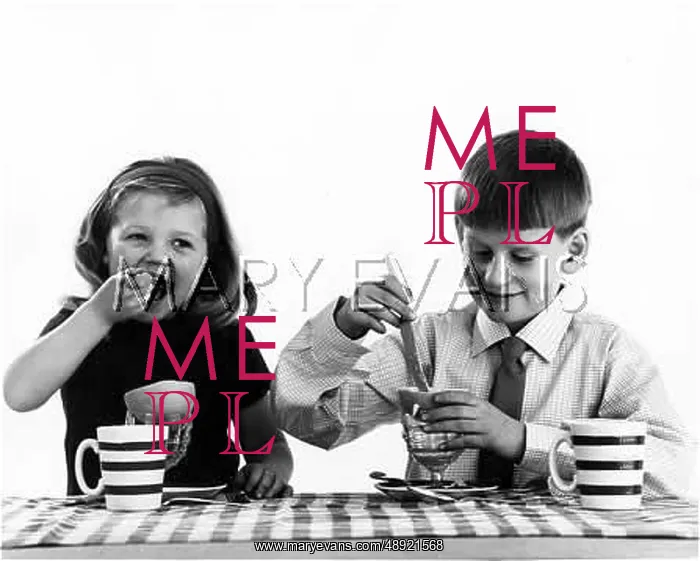  : BREAKFAST. Two children have grapefruit for their breakfast