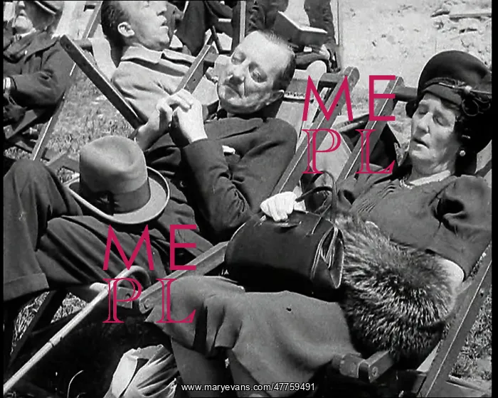 : A British Couple Asleep in Deckchairs in the : A British Couple Asleep in Deckchairs in the