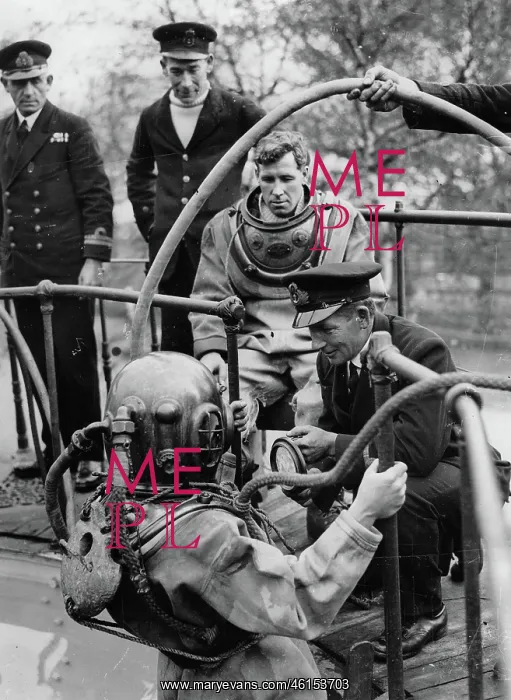  : British navy divers in wetsuits when