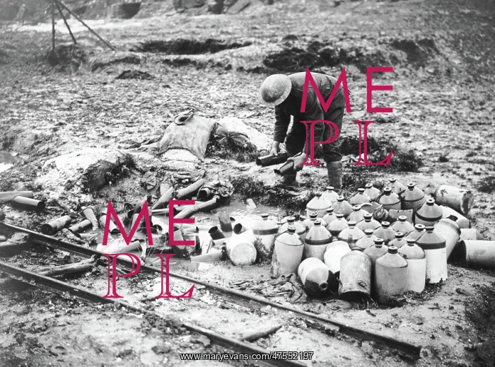 : British soldier cleaning up debris, Western Front, WW1 : British soldier cleaning up debris, Western Front, WW1