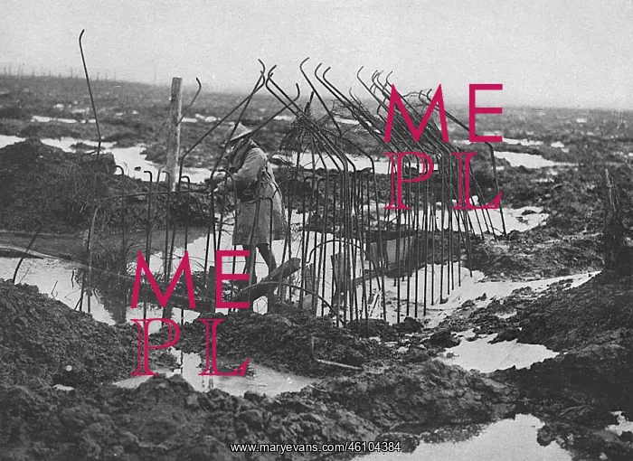 : British soldier examing framework of pill-box, WW1 : British soldier examing framework of pill-box, WW1