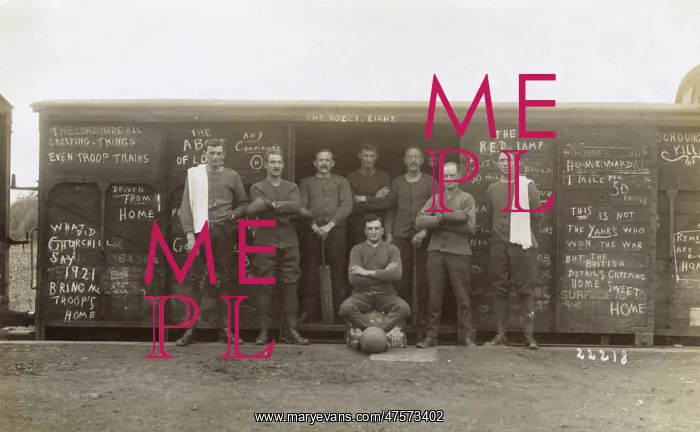 : British soldiers standing outside a troop train : British soldiers standing outside a troop train