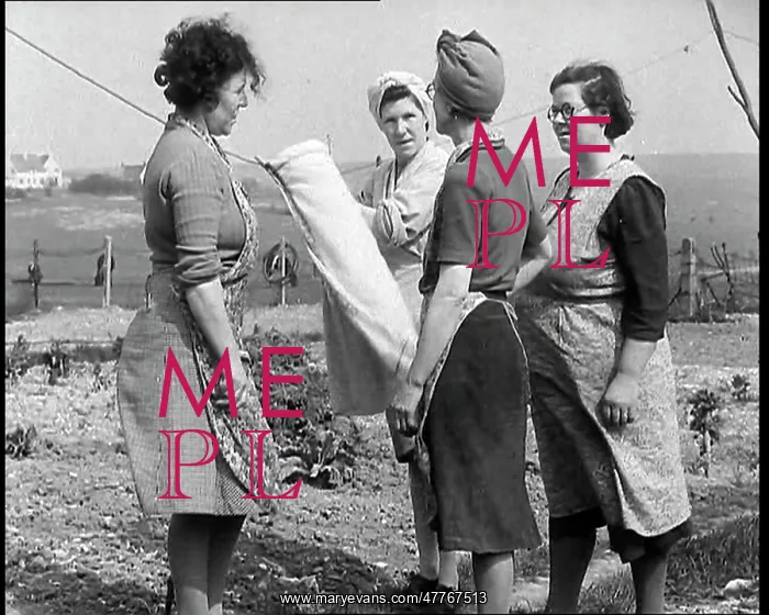: Four British Women Wearing Aprons and Talking : Four British Women Wearing Aprons and Talking