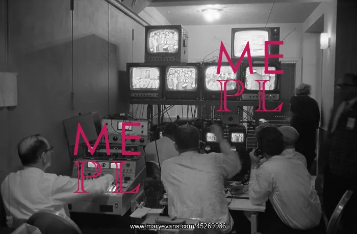 : Broadcasting technicians, seated in front of bank : Broadcasting technicians, seated in front of bank