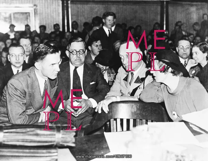 : Bruno Hauptmann shown leaning over for a whispered : Bruno Hauptmann shown leaning over for a whispered