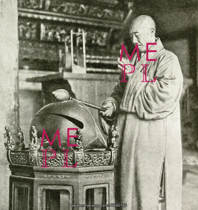 : Buddhist priest striking a temple bell, China, East Asia : Buddhist priest striking a temple bell, China, East Asia