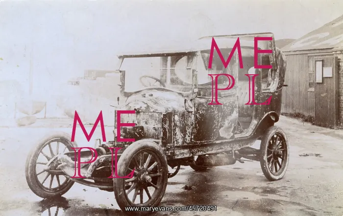 : Burnt-out shell of an early motor car : Burnt-out shell of an early motor car