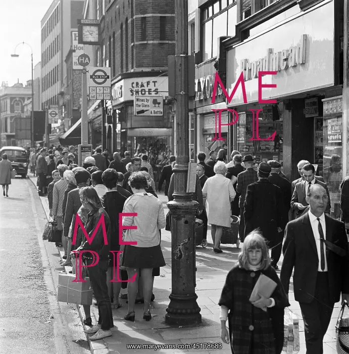 : Bus queue. A view looking north along Camden High Street in London showing : Bus queue. A view looking north along Camden High Street in London showing