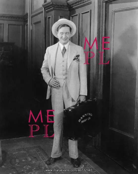 : Businessman holding a briefcase and smiling : Businessman holding a briefcase and smiling