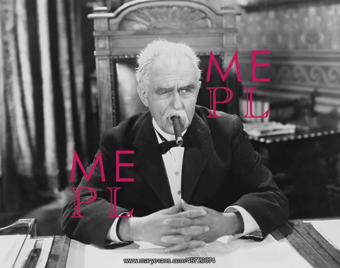 : Businessman smoking cigar at desk : Businessman smoking cigar at desk