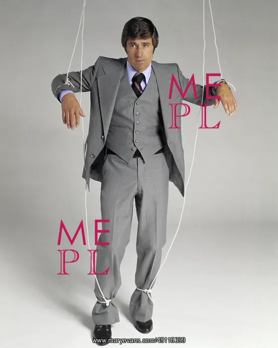 : Businessman Suspended on Puppet Strings Looking at Camera : Businessman Suspended on Puppet Strings Looking at Camera