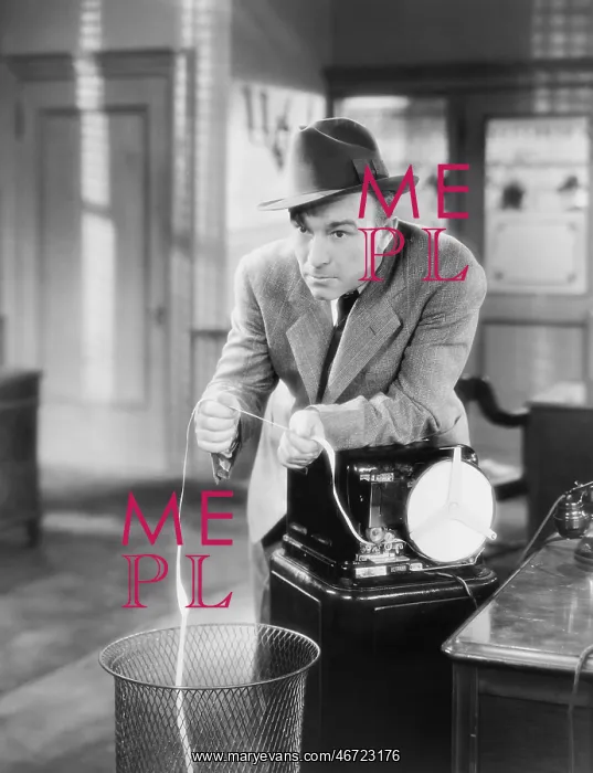 : Businessman with ticker tape machine : Businessman with ticker tape machine