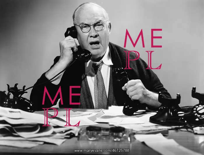  : Businessman using multiple phones