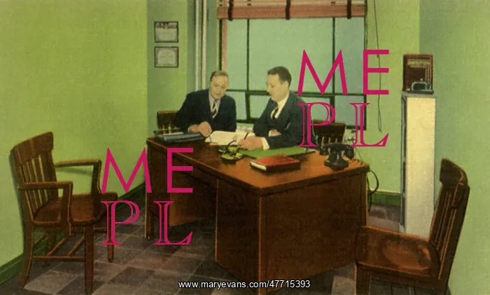  : Two businessmen sit at a desk