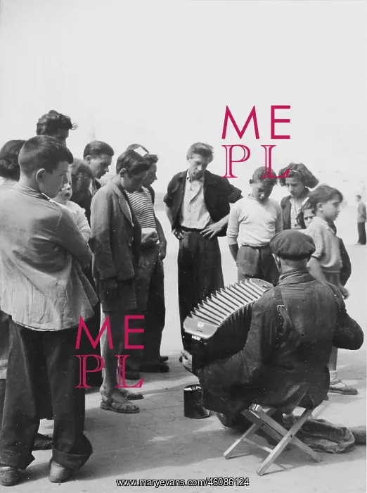 : Busker with an accordion. About 1955 : Busker with an accordion. About 1955