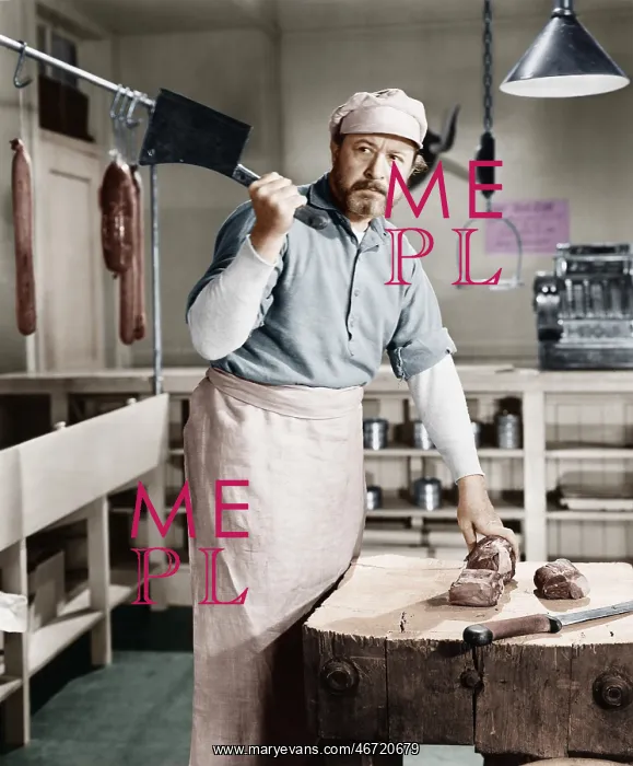 : Butcher chopping meat with cleaver : Butcher chopping meat with cleaver