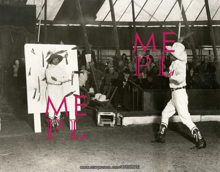 : c.1920's - flaming knife throwing act, Bertram Mills circus : c.1920's - flaming knife throwing act, Bertram Mills circus