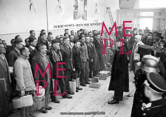 : Camp Commander Theodor Eicke speaks to prisoners in the Dach : Camp Commander Theodor Eicke speaks to prisoners in the Dach