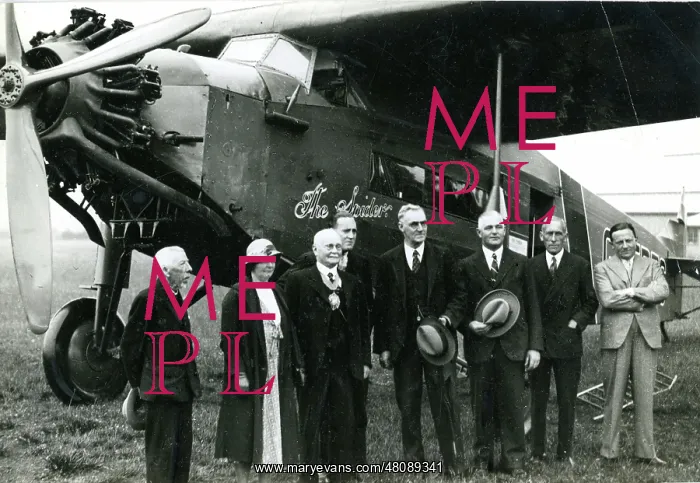 : Capt C.D. Barnard, fourth from left, pilot, in front of : Capt C.D. Barnard, fourth from left, pilot, in front of