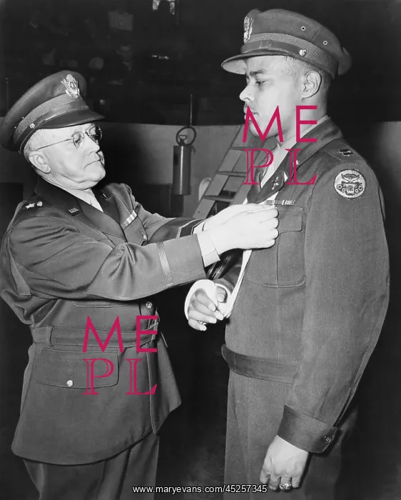: Capt. Charles L. Thomas, receives the Distinguished : Capt. Charles L. Thomas, receives the Distinguished