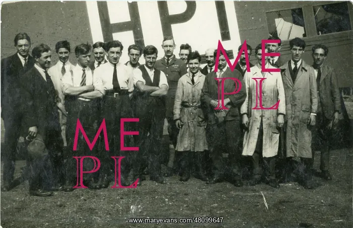 : Capt G.T.R. Hill (centre) with a group of mechanics in f : Capt G.T.R. Hill (centre) with a group of mechanics in f