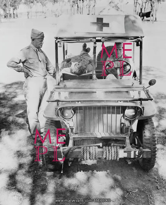 : Captain Nelson inspecting a half-ton jeep : Captain Nelson inspecting a half-ton jeep