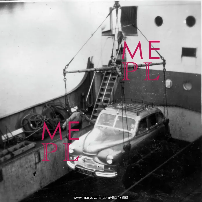 : Car lowered to deck of ferry : Car lowered to deck of ferry