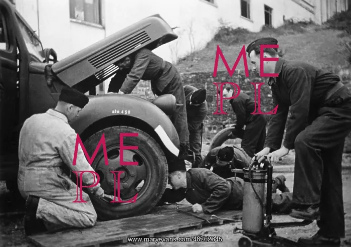 : Car repair in Alsace, 1940 : Car repair in Alsace, 1940