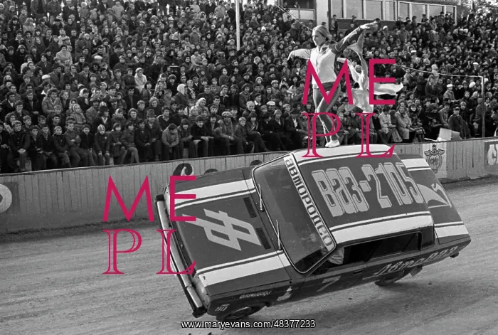 : Car Rodeo. USSR. October 15, 1980. Female athlete performs a stunt on a new Lada VAZ 2105 : Car Rodeo. USSR. October 15, 1980. Female athlete performs a stunt on a new Lada VAZ 2105