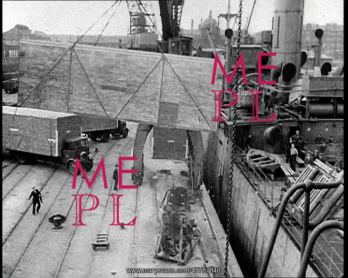 : Cargo Being Unloaded by Crane From a Cargo Ship : Cargo Being Unloaded by Crane From a Cargo Ship