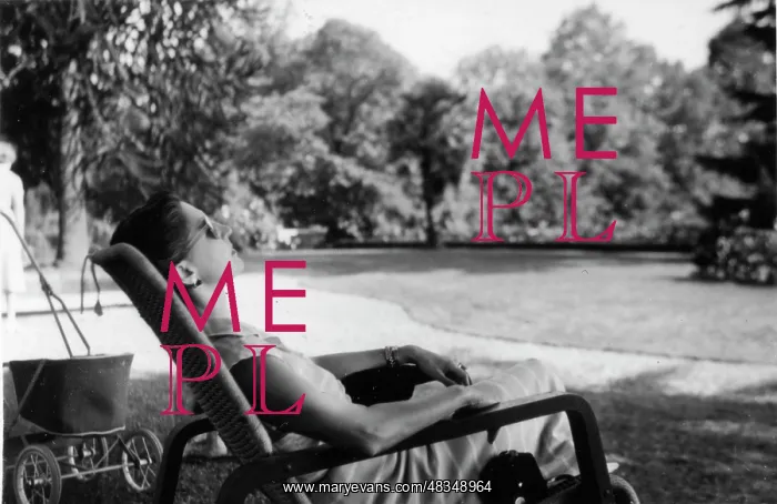 : Carly sunbathing in a garden : Carly sunbathing in a garden