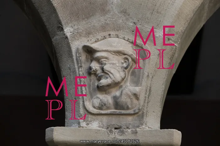 : Carved figures of pupils, between the arches of the patio : Carved figures of pupils, between the arches of the patio