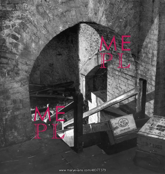: Cases of Moet & Chandon Champagne in a brick cellar : Cases of Moet & Chandon Champagne in a brick cellar