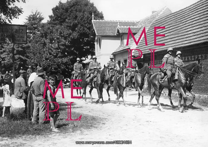 : Cavalry patrol passes through a village : Cavalry patrol passes through a village