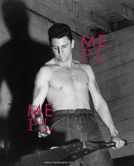 : CCC enrollee forging a piece of steel in a CCC : CCC enrollee forging a piece of steel in a CCC