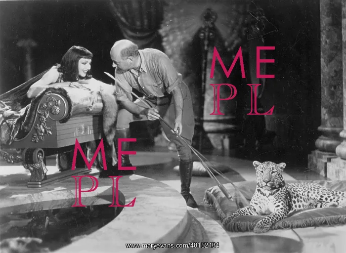 : Cecil B DeMille and Claudette Colbert during the filming of : Cecil B DeMille and Claudette Colbert during the filming of