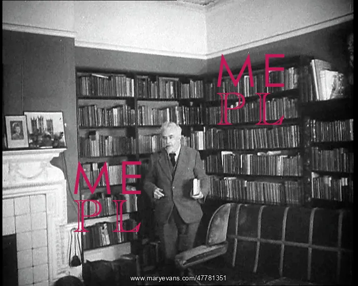 : C.E.M Joad Taking Some Books to His Desk : C.E.M Joad Taking Some Books to His Desk