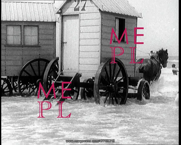 : Two Changing Cabins on Wheels Being Pulled : Two Changing Cabins on Wheels Being Pulled