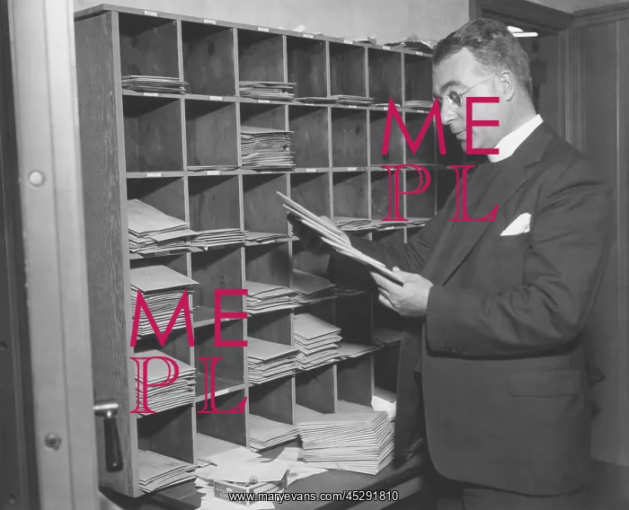 : Charles Coughlin looking at his mail in 1934. At : Charles Coughlin looking at his mail in 1934. At
