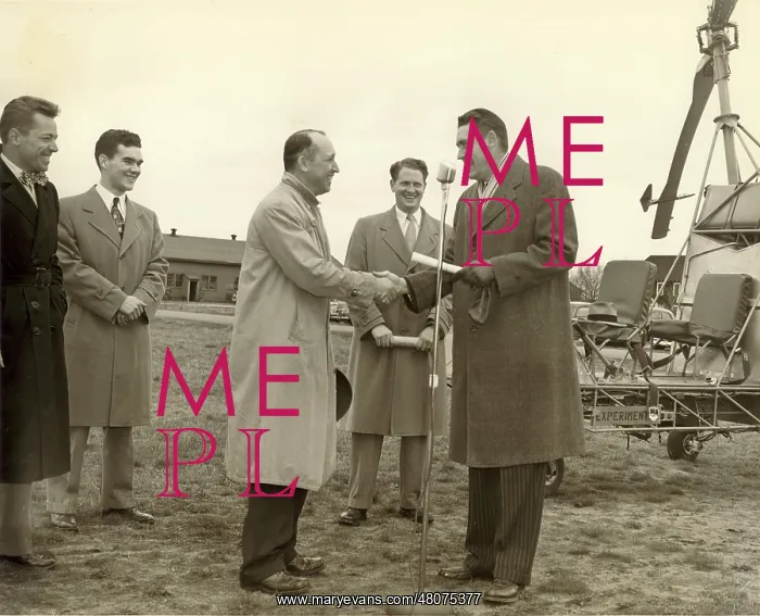  : Charles H Kaman receiving the first CAA certificate