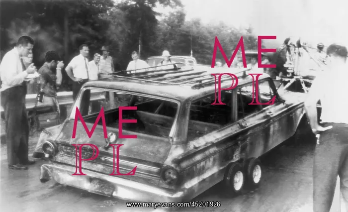 : Charred remains of station wagon driven ? : Charred remains of station wagon driven ?