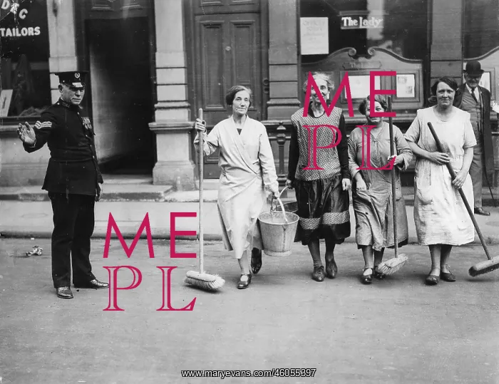 : Charwomen crossing the street outside the offices of The Lady Magazine : Charwomen crossing the street outside the offices of The Lady Magazine