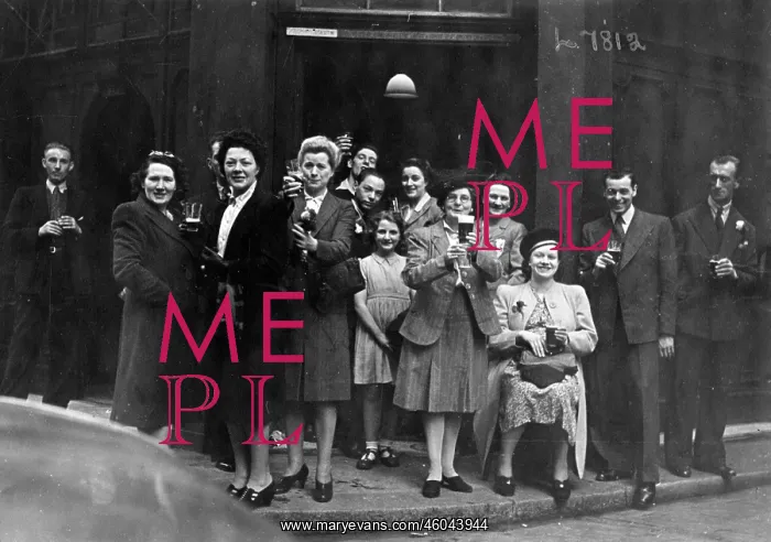 : Cheers. A group of people raise their glasses of beer in a toast outside : Cheers. A group of people raise their glasses of beer in a toast outside